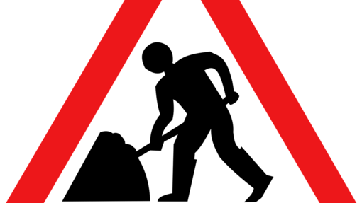 Verkehrsschild weiß, rot, schwarz mit Person die schaufelt